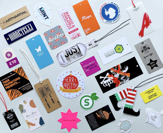 A variety of custom printed swing tags in different shapes, sizes and materials