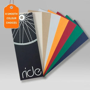 Set of eight smooth colour choice swing tags with a bicycle wheel design on a grey background